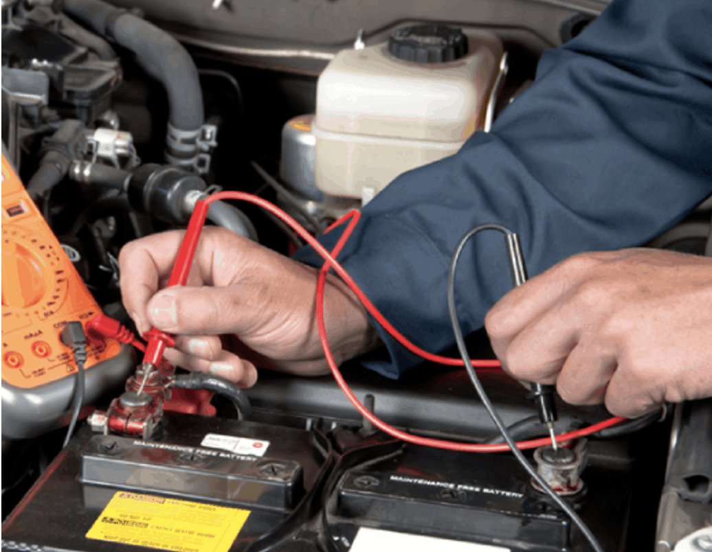 An Auto Electrician inspecting a vehicle.